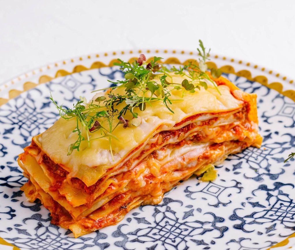 fresh homemade lasagna on ornate plate